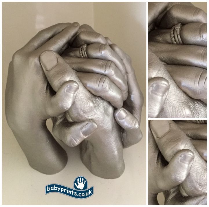 Family clasping hands statues