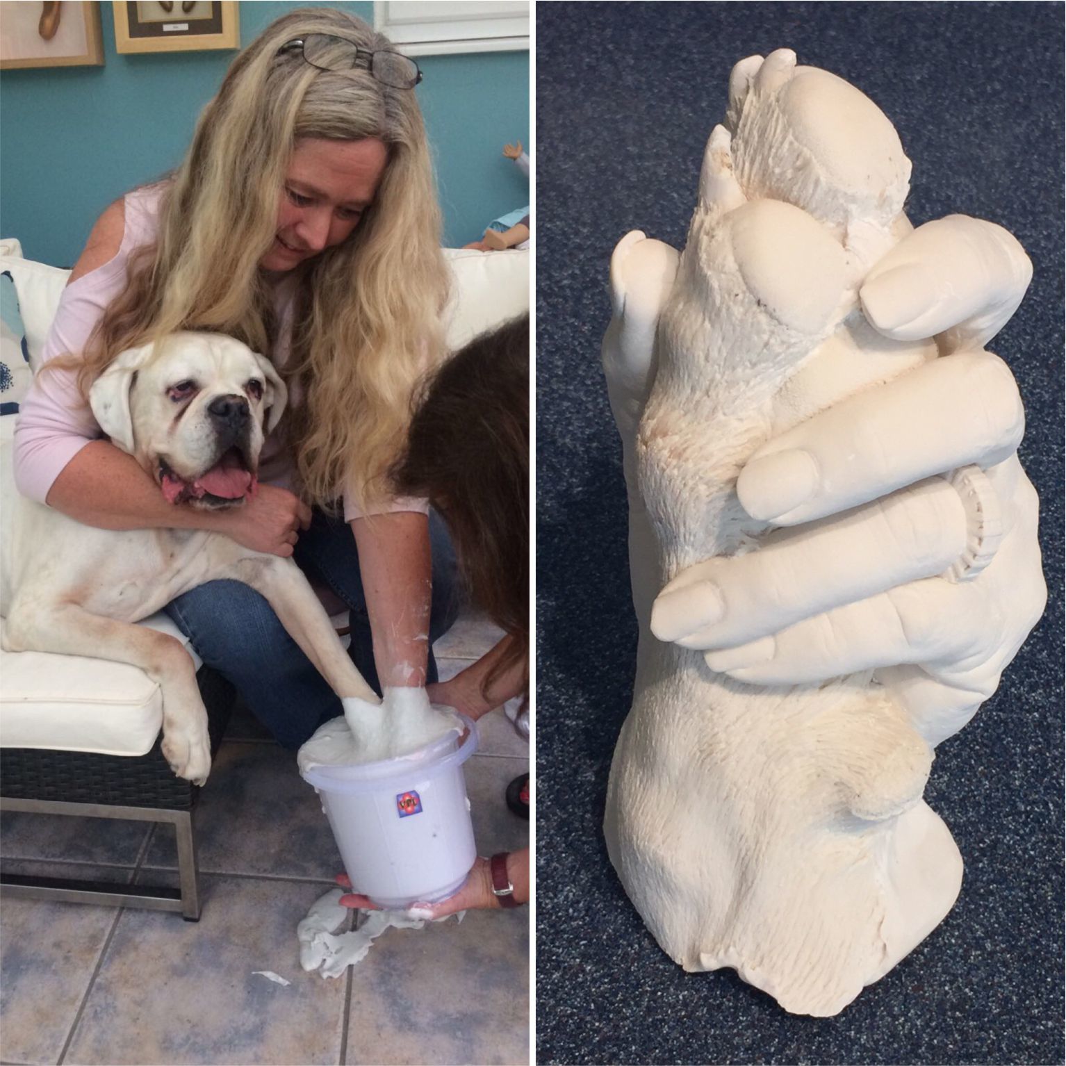 Hand holding dog paw statue