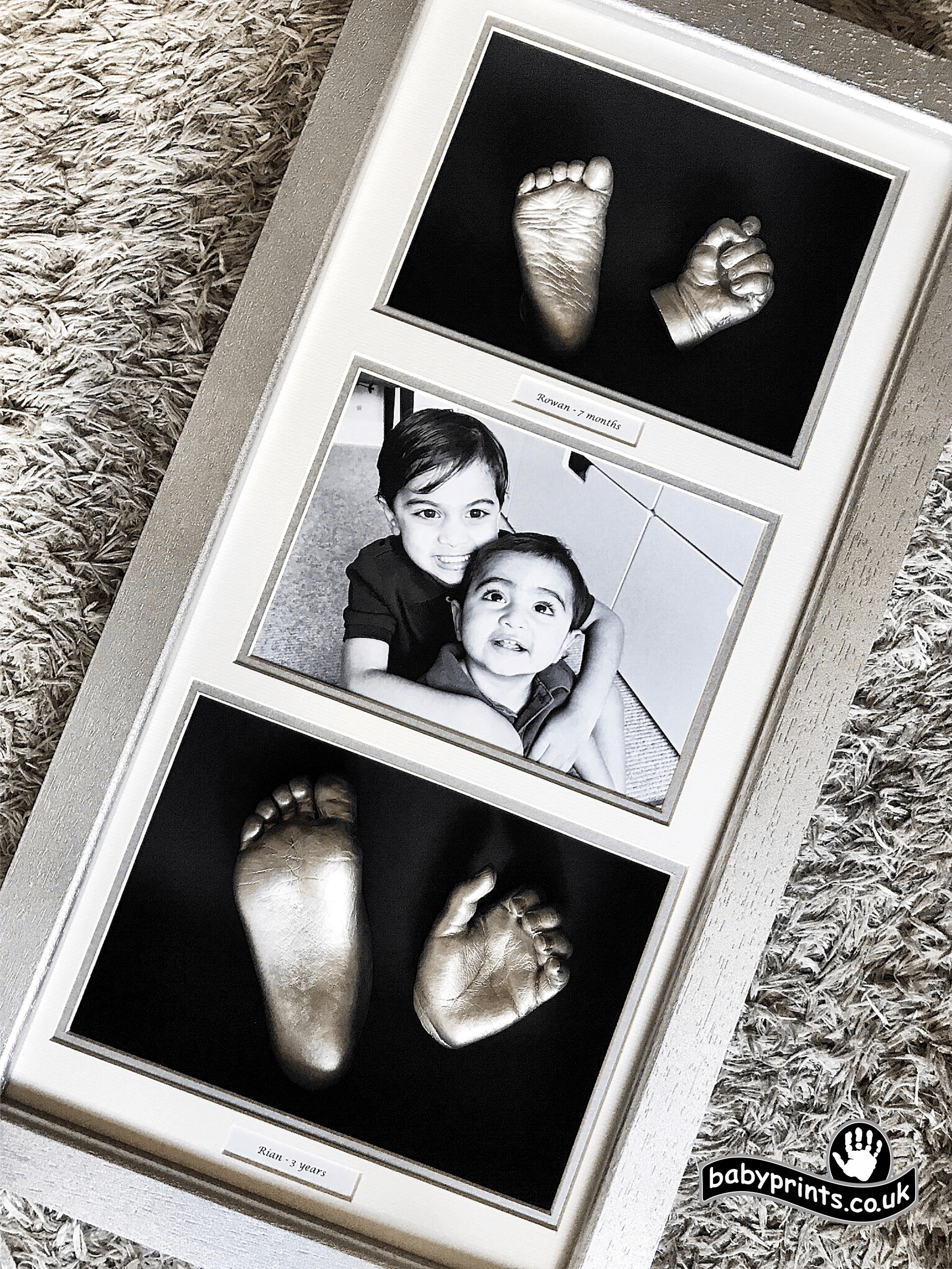 Brothers foot and hand casting in a frame